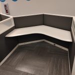 Cubicle with curved desk