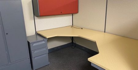 Office cubicle with desk and furniture