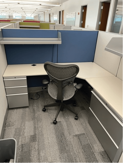 Blue and white cubicle with chair